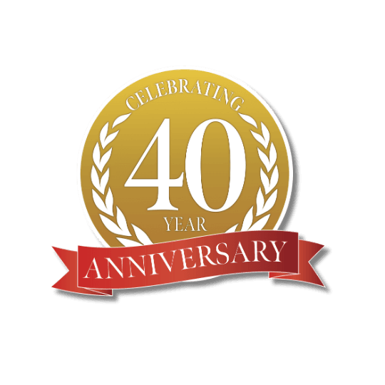 Gold circle with "Celebrating 40 Year Anniversary" in white text, laurel accents, and a red ribbon on a black background. Elegant and festive.