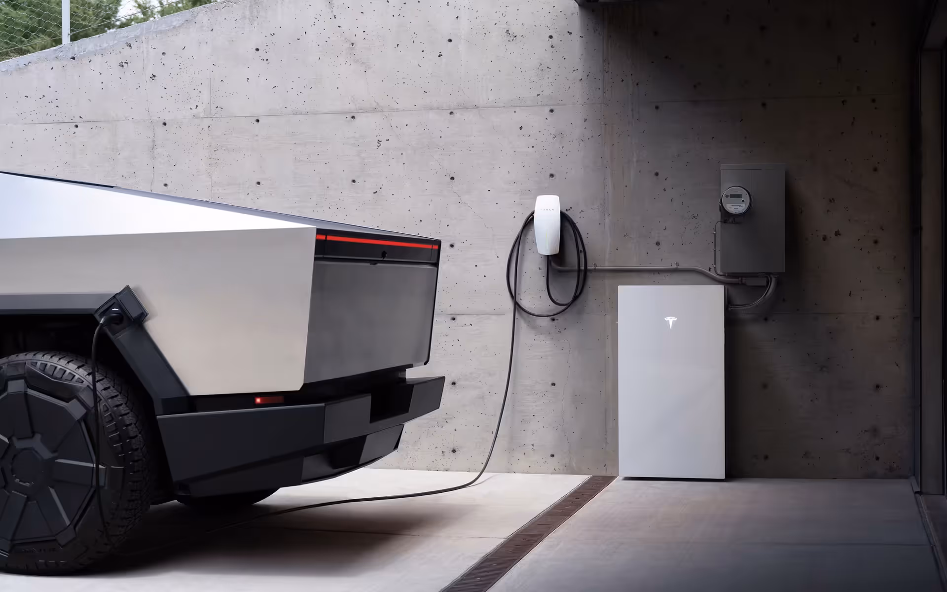 A futuristic electric truck is parked in a concrete garage, charging via a wall-mounted unit. The scene conveys a modern and eco-friendly vibe.