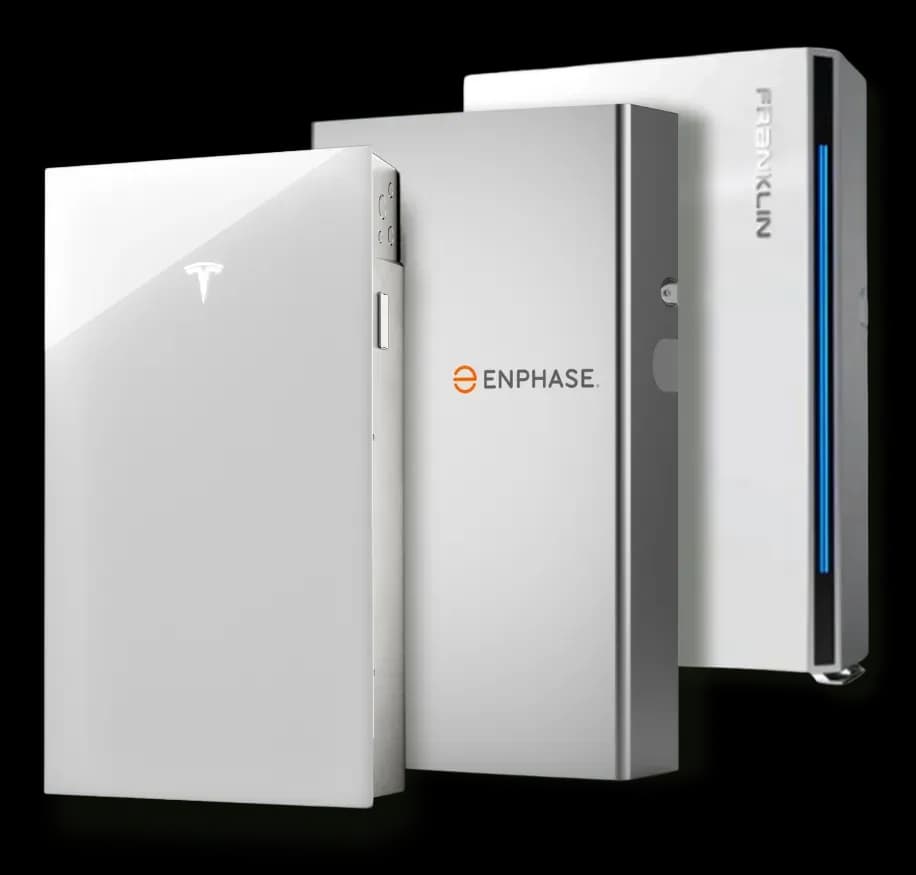 Three sleek home battery systems stand upright against a black background. The brands displayed are Tesla, Enphase, and Franklin, each in minimalist design.
